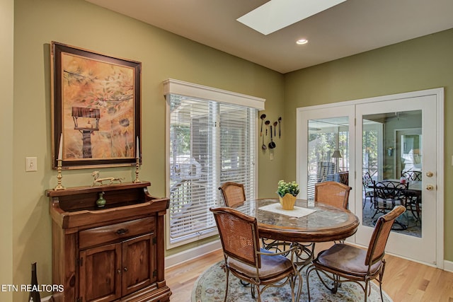 108 Waynoka Ln, Loudon, TN 37774 - dining space with baseboards, light wood-style flooring, a skylight, and recessed lighting