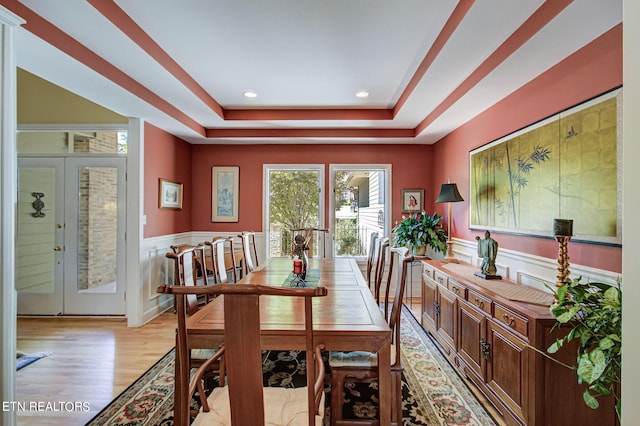 108 Waynoka Ln, Loudon, TN 37774 - dining room with a wainscoted wall, light wood-style flooring, recessed lighting, and a raised ceiling