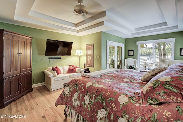 108 Waynoka Ln, Loudon, TN 37774 - bedroom featuring access to exterior, a ceiling fan, light wood-style flooring, and a raised ceiling