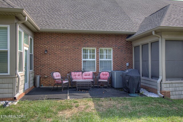 view of patio featuring an outdoor living space, central air condition unit, and grilling area