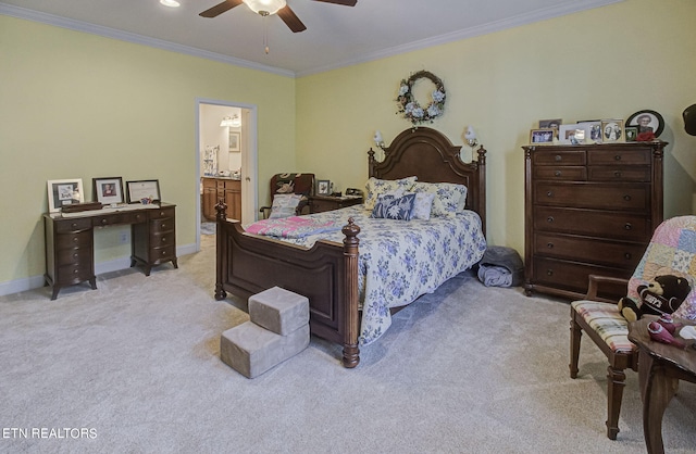 bedroom featuring ceiling fan, ornamental molding, light carpet, and ensuite bathroom