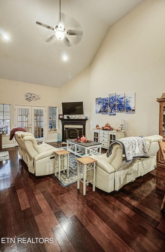 living room with dark hardwood / wood-style flooring, high vaulted ceiling, and ceiling fan