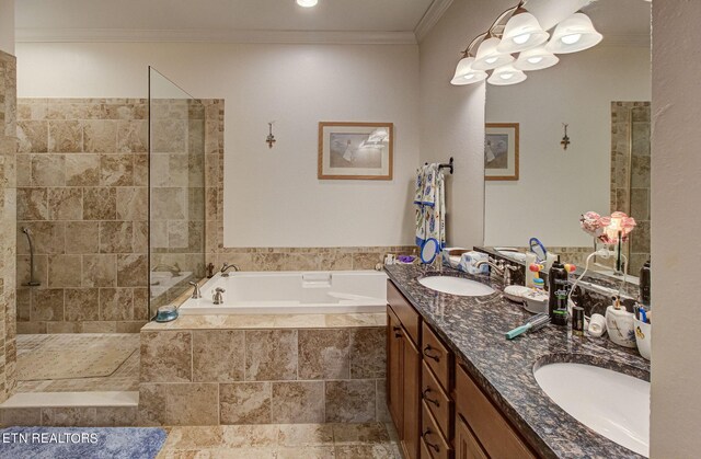 bathroom featuring crown molding, vanity, and shower with separate bathtub