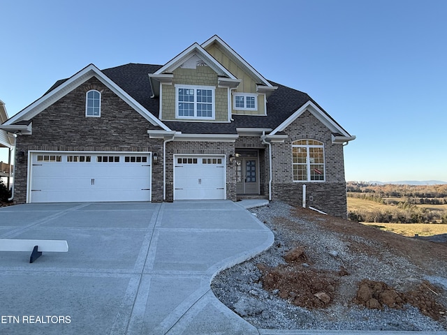 craftsman-style home with a garage