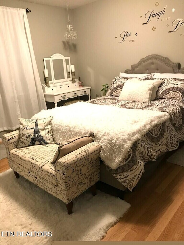 bedroom with wood finished floors