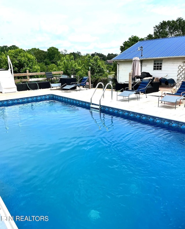 pool with a patio