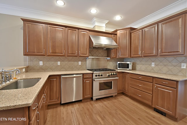 kitchen with range hood, light hardwood / wood-style floors, crown molding, stainless steel appliances, and sink