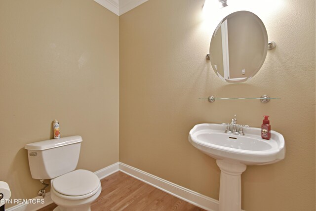 bathroom featuring toilet and hardwood / wood-style floors