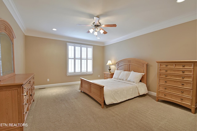 bedroom with ceiling fan, light carpet, and ornamental molding