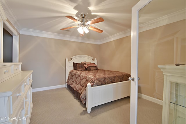 bedroom featuring crown molding, light colored carpet, and ceiling fan