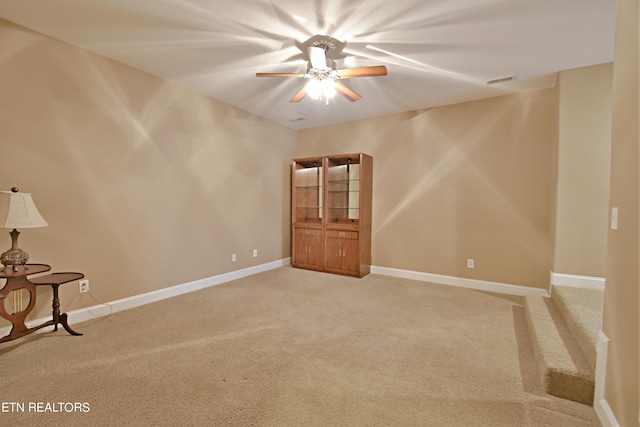 carpeted empty room with ceiling fan