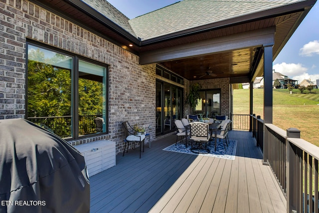 deck featuring grilling area and ceiling fan