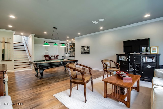 rec room featuring billiards, light hardwood / wood-style flooring, and crown molding