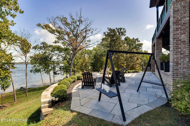 view of patio / terrace featuring a water view