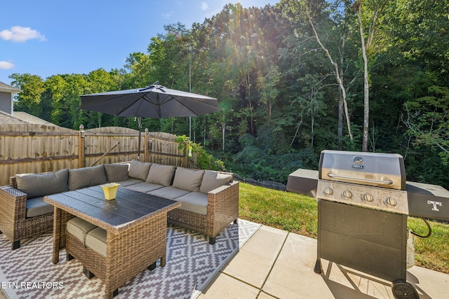 view of patio with area for grilling and an outdoor hangout area