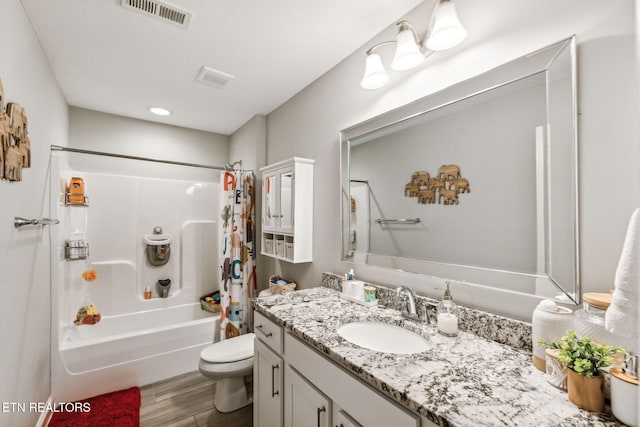 full bathroom with shower / tub combo with curtain, vanity, wood-type flooring, and toilet