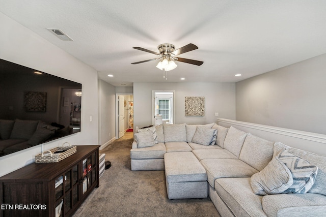 living room featuring ceiling fan and carpet floors