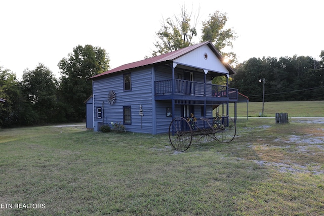 rear view of house with a lawn