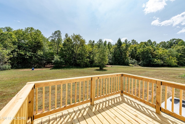 wooden terrace with a lawn