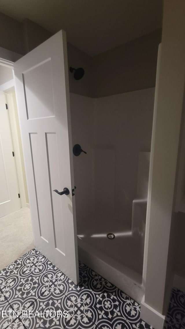 bathroom featuring walk in shower