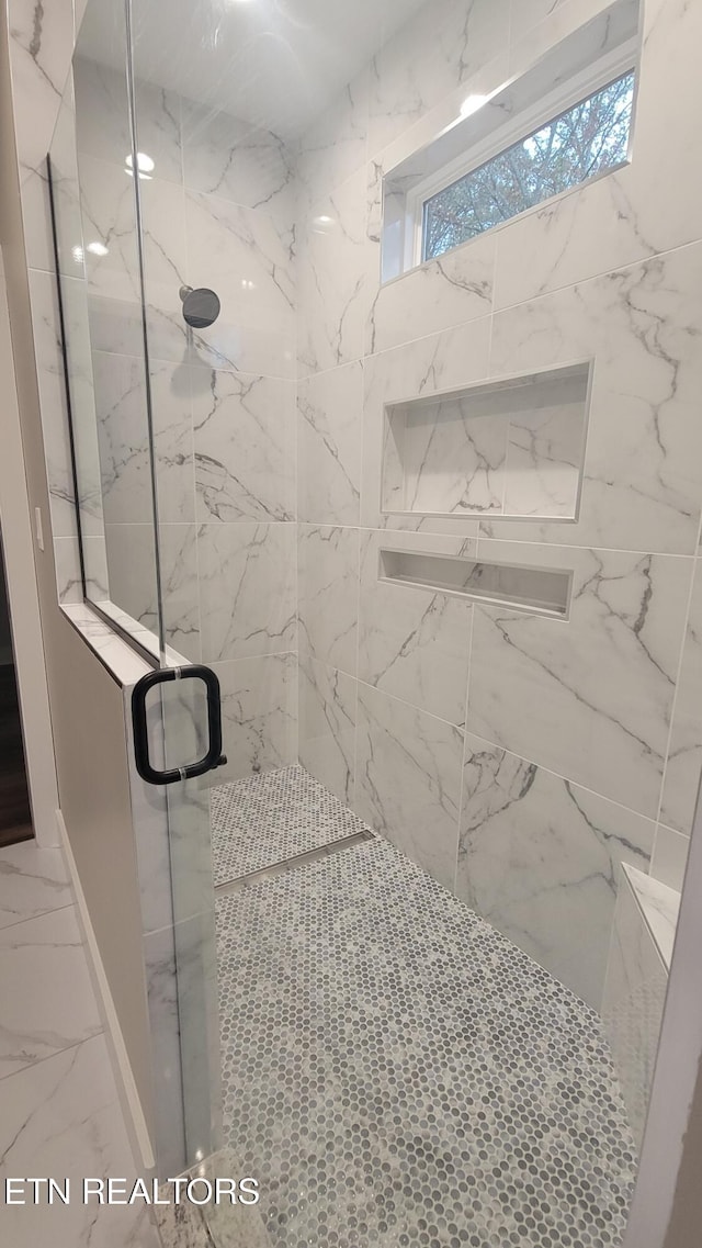 bathroom featuring an enclosed shower