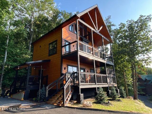 rear view of house featuring a balcony