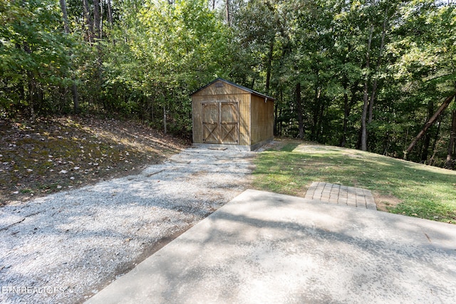 view of outbuilding with a lawn