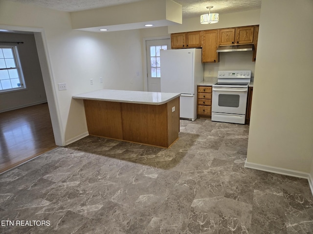 kitchen featuring kitchen peninsula, a textured ceiling, white appliances, and plenty of natural light