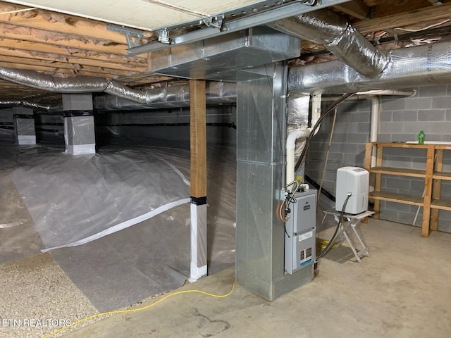 basement featuring heating unit