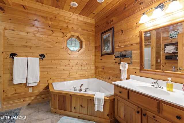 bathroom with tile patterned floors, wooden ceiling, a washtub, wood walls, and vanity