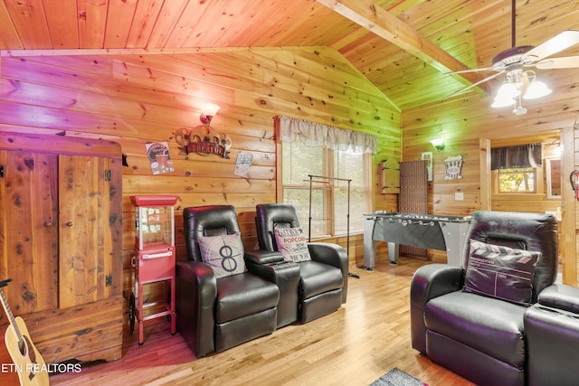 cinema room with wood ceiling, hardwood / wood-style floors, ceiling fan, and vaulted ceiling with beams