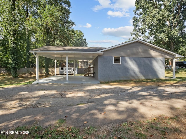 exterior space featuring a carport