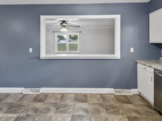 interior space with ceiling fan and ornamental molding