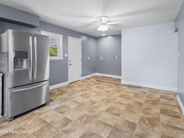 kitchen with ceiling fan and stainless steel refrigerator with ice dispenser