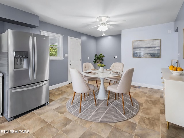 dining space with ceiling fan