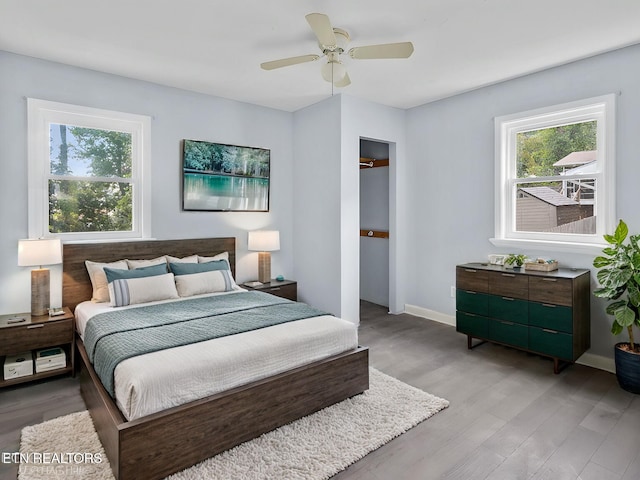 bedroom featuring ceiling fan and light hardwood / wood-style flooring