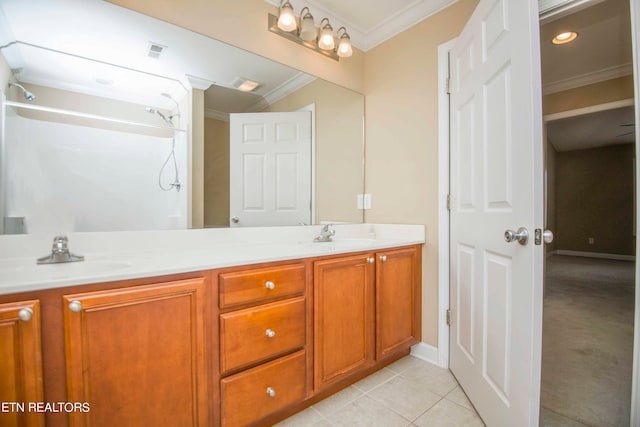 bathroom with crown molding, vanity, walk in shower, and tile patterned flooring