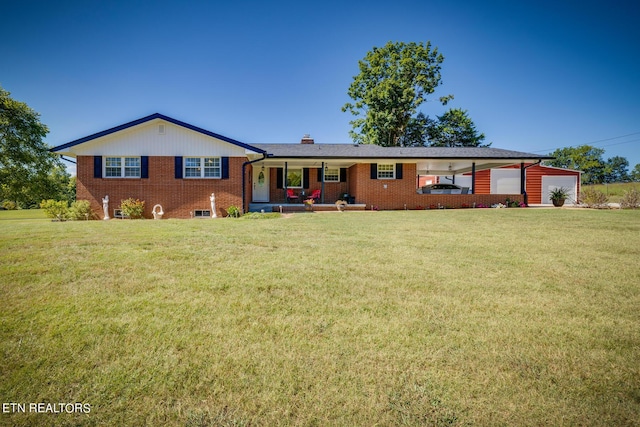 view of front of home featuring brick siding, an attached garage, a chimney, and a front lawn