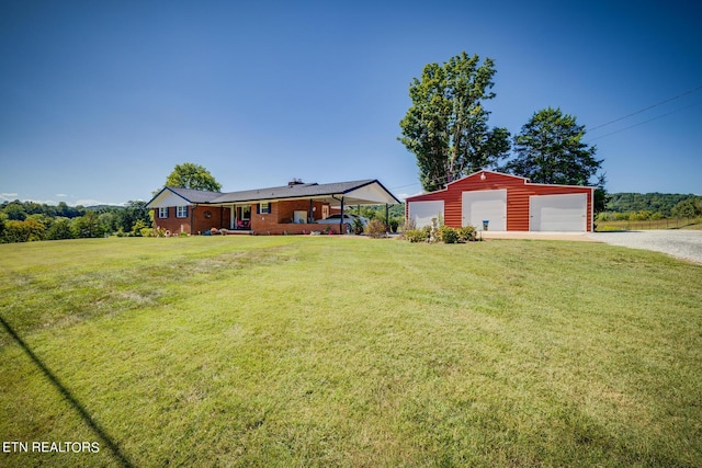 single story home with a garage, a front lawn, an outdoor structure, and gravel driveway