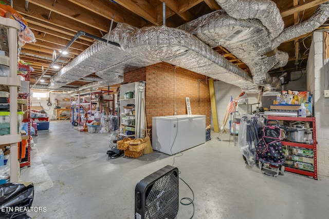 basement featuring white fridge