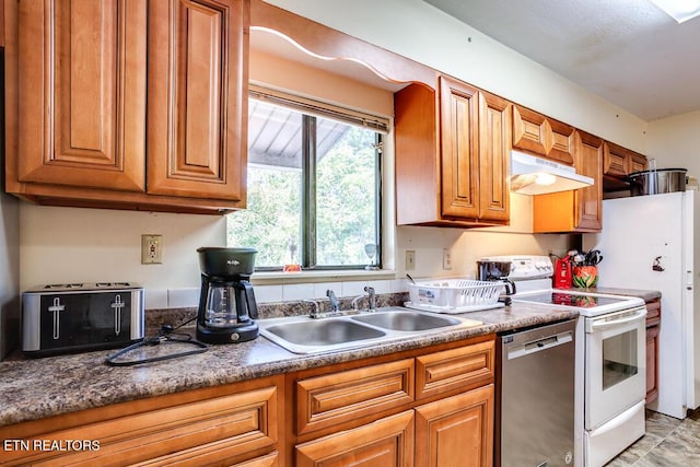 kitchen featuring under cabinet range hood, stainless steel dishwasher, white range with electric cooktop, a sink, and brown cabinets