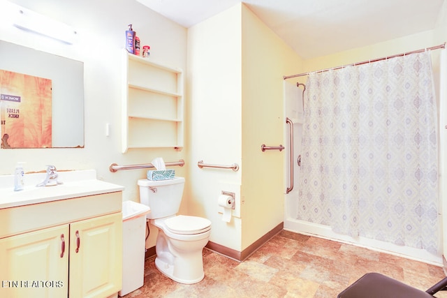 bathroom featuring curtained shower, toilet, and vanity