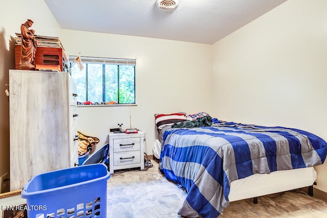 bedroom featuring a textured ceiling