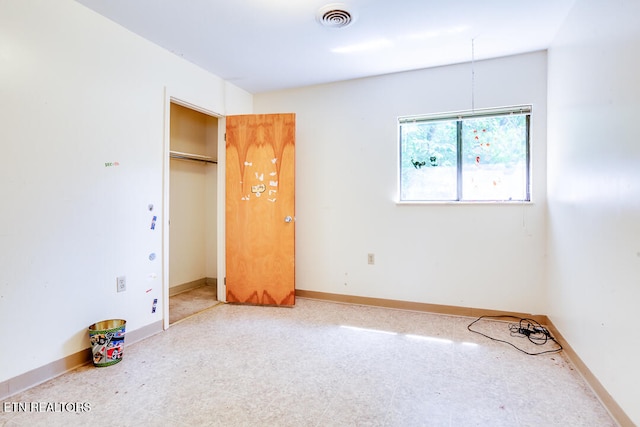 unfurnished bedroom featuring a closet