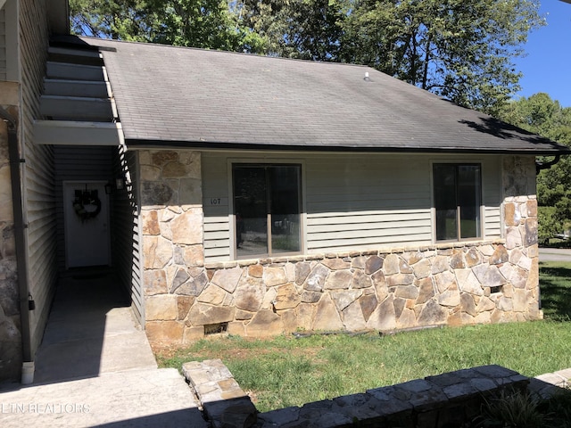 exterior space featuring stone siding