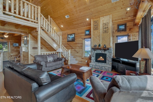 living room featuring wooden walls, wood ceiling, and hardwood / wood-style flooring