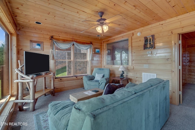 living room featuring carpet floors and wood ceiling