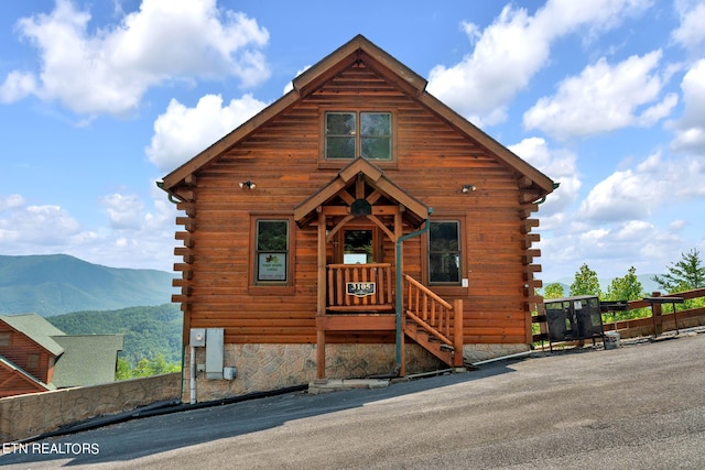 log home with a mountain view