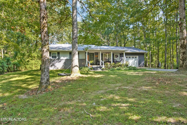 single story home with covered porch, a front yard, and a garage