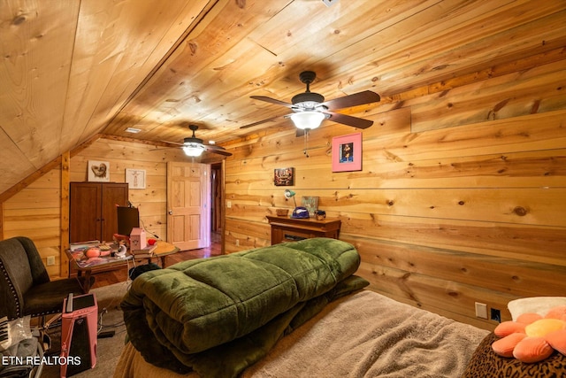 interior space featuring wood walls, wood ceiling, ceiling fan, and vaulted ceiling